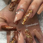 So beautiful nude coffin nails with glitter, rhinestones, and marble effects!...